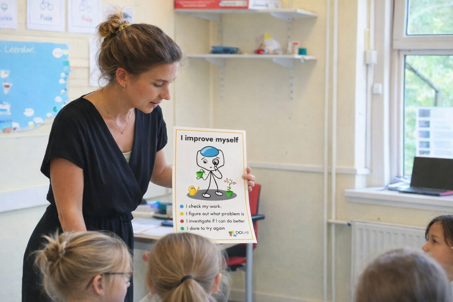 Teacher showing growth mindset poster to students